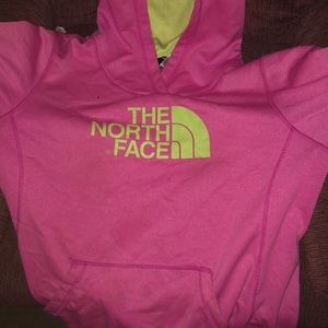 A pink North Face hoodie.